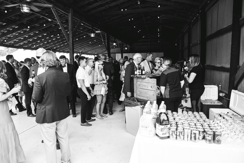 Guest Enjoying Drinks at Stephen and Anne Stuart's Wedding - Maria Grace Photography